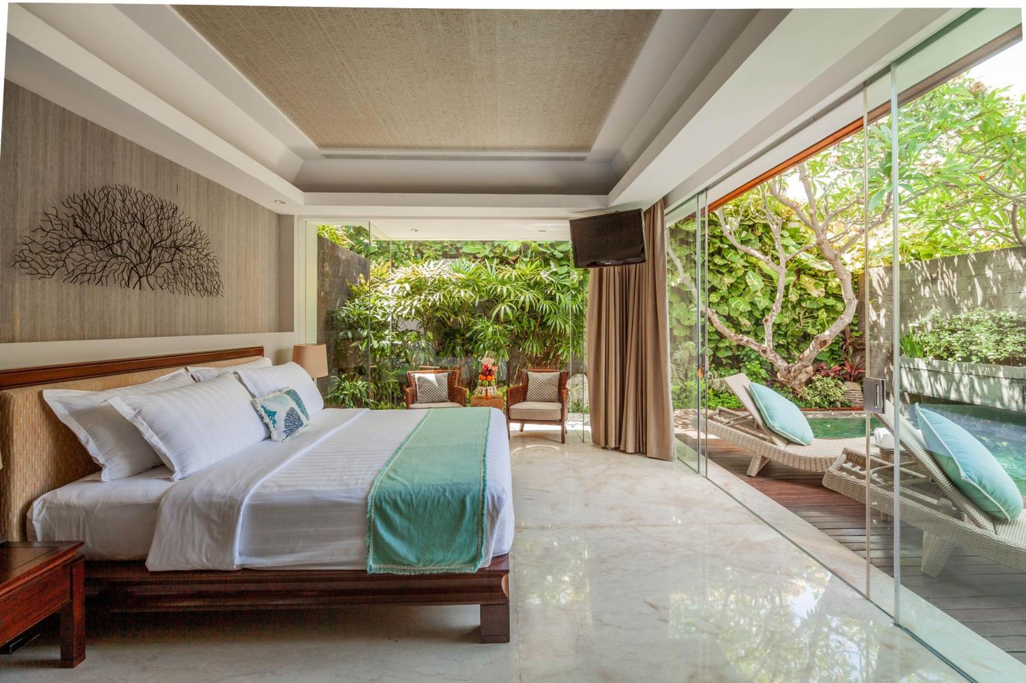 巴厘曼迪拉海滩Spa度假酒店 勒吉安 外观 照片 A bedroom at the hotel